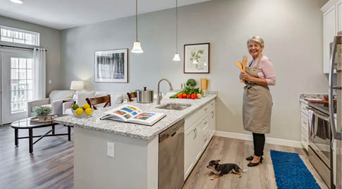 A woman is standing in a kitchen with a dog. AI generated content