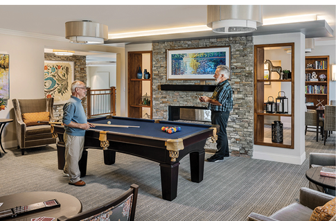 Two men playing pool in a living room. AI generated content